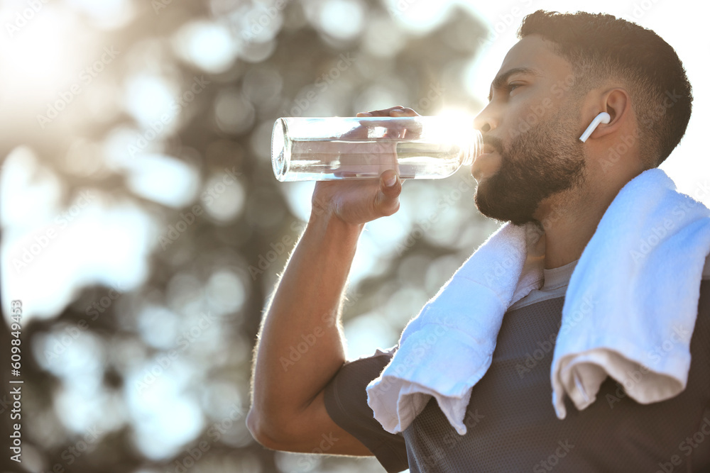 Wall mural man, fitness and drinking water in nature for sustainability, hydration or break after running worko