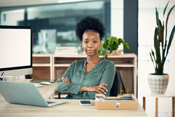 Portrait, black woman and accountant with arms crossed, laptop and confident in office. Computer, face and female entrepreneur, auditor and professional from South Africa with business mockup space.