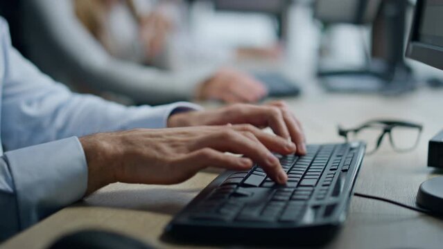 Closeup hands typing pc keyboard in office. Man manager working surfing internet