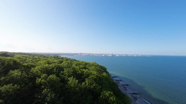 View of Aarhus from the Marselisborg forest over the water.