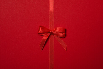 Concept of different ribbons, red ribbon on red background