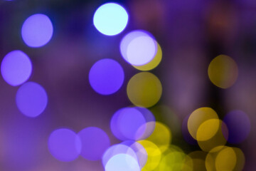 Abstract multicolored bokeh on a dark background. Beautiful background with colorful bokeh on a black background