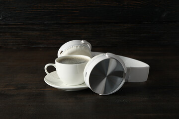 Concept of freelance, composition with hot drink and headphones