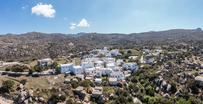 Greece. Tinos island Cyclades. Panoramic view of Volax village, granite stone background.