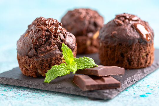Chocolate muffins with zucchini close-up.