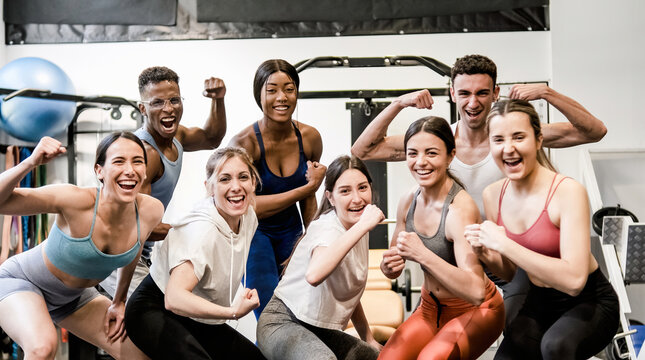 Happy diverse sportspeople having fun in fitness club together