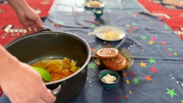Fry egg omelet traditional cookies and cheese butter in a Persian dining table of breakfast in morning at home local people hospitality travel to rural area experience the country life in middle east