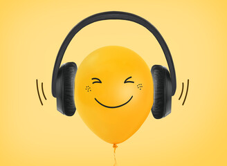 Yellow balloon wearing headphones concept on yellow background