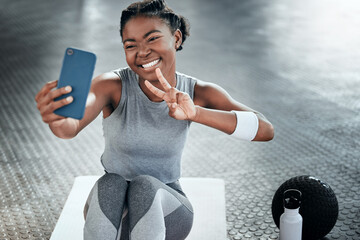 Black woman, gym selfie and peace with smile on floor for fitness, workout and wellness on social...