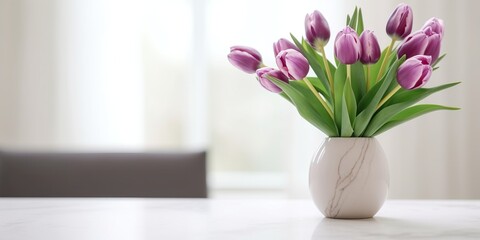 Beautiful vase of tulip flowers on the table with light exposure