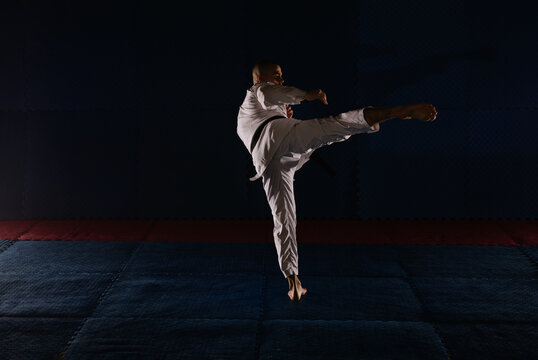 Karatist doing Mae Geri at the studio