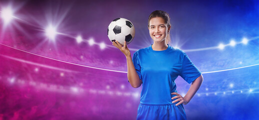 Textured soccer game field with young smiling female soccer player holding soccer ball in neon fog - center, midfield