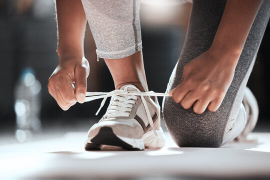 Hands, Shoelaces And Floor At Gym With Woman, Fitness And Ready For Workout, Wellness Or Training. Girl, Sport Shoes Or Sneakers For Exercise, Performance Or Health For Lifestyle, Motivation And Club