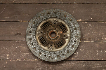 Disassembled clutch disc of a car in a car service repair shop