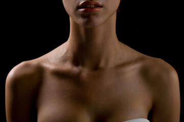 Bust of a woman, focusing on the neck and shoulders, frontal view, natural skin, lighting with...