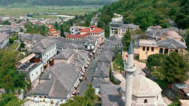 Aerial drone view of old quarters of Gjirokaster, Albania. Traditional houses in the old city of Gjirokaster. UNESCO World Heritage Site.