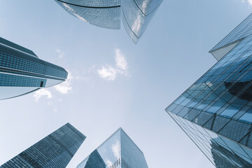 Business skyscrapers and office business center building architecture in perspective on blue sky....