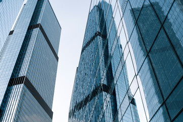 Business skyscrapers and office business center building architecture in perspective on blue sky....