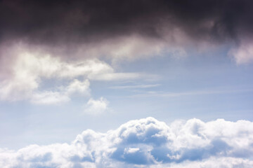 sunny weather forecast background. blue sky with white clouds above horizon in morning light