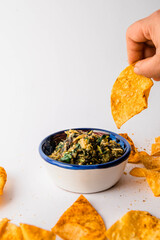 Mexican taco chips with green tomatillo salsa