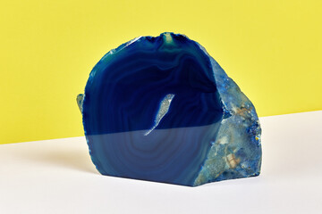 modern product image of a piece of agate with a background of white and yellow modern minimalistic...