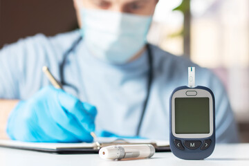 the doctor shows the level of sugar in the blood and enters them into the patient's medical form, Mockup