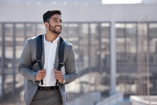 Travel, happy and businessman walking in the city to his office building in the morning. Confidence, backpack and professional male employee with a smile commuting to work in an urban town street. - Powered by Adobe