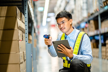 Warehouse workers use scanner checking and scan the barcode of stock inventory to keep storage in a system, Smart warehouse management system, Supply chain and logistic network technology concept.