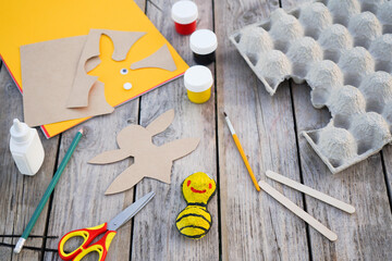 Step by step diy process. Step 5- we cut out wings from a sheet of cardboard. Creativity, crafting. Zero waste concept.