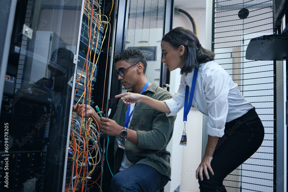 Poster IT people, engineer or server room cable for programming or connection maintenance. Man and woman technician in datacenter for network, cybersecurity software or data center problem or system upgrade