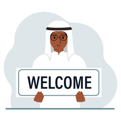 A man holds in his hands a large sign, banner, postcard with the text Welcome.