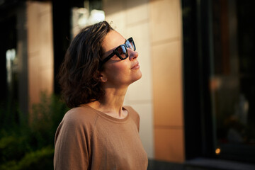 Melancholic beautiful portrait profile. Young adult in the sunglasses. Romantic affecting mood. High quality photo