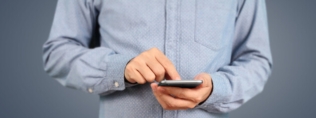 Man holding smartphone device  touching screen