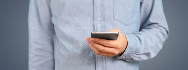 Man holding smartphone device  touching screen