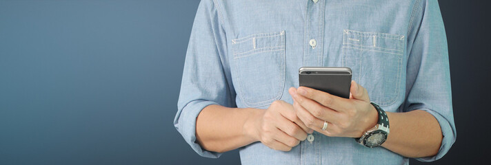 Man holding smartphone device  touching screen