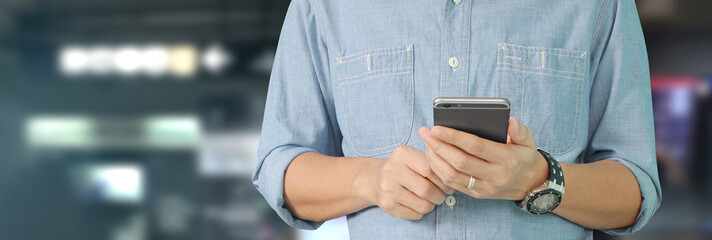 Man holding smartphone device  touching screen