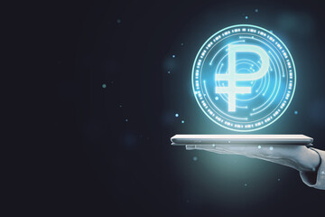 Close up of hand holding smartphone with digital round ruble sign on dark background with blurry mock up place. Online banking, cryptocurrency and finance concept.