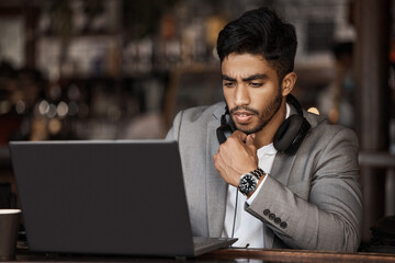 Thinking, laptop or businessman with research in cafe reading news for online stock market update....