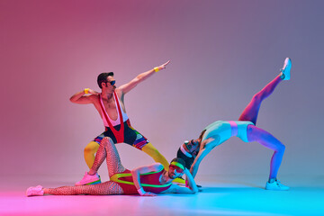 Young people, men in colorful retro sportswear training against gradient blue pink studio...