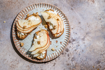 bruschetta with pear, goat cheese spread, nuts and honey