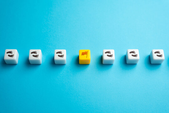 Complete a milestone. Achieve an intermediate goal. Progress mark. Each step brings closer to destination. Progress and success are achieved by taking one small step at a time.