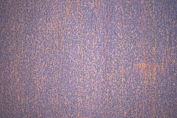 Abstract old rusty metal texture pattern. Purple orange brown iron surface background. Rusted purple painted metal wall outdoors