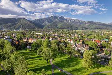 Aerial view of Zakopane town with Tatra mountains range in summer, Poland. - obrazy, fototapety, plakaty
