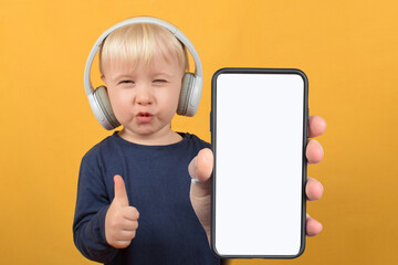 cute boy child showing smartphone with white blank screen