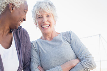 Senior women laughing outdoors