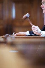 Judge banging gavel in court 