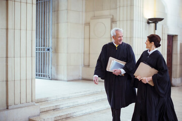 Judges walking through courthouse together 