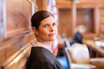 Judge standing in courtroom