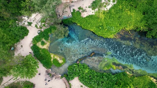 Aerial rising over Blue eye spring a natural phenomenon in Albania