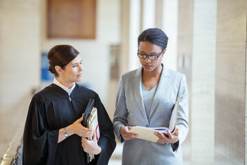 Judge and lawyer talking in courthouse